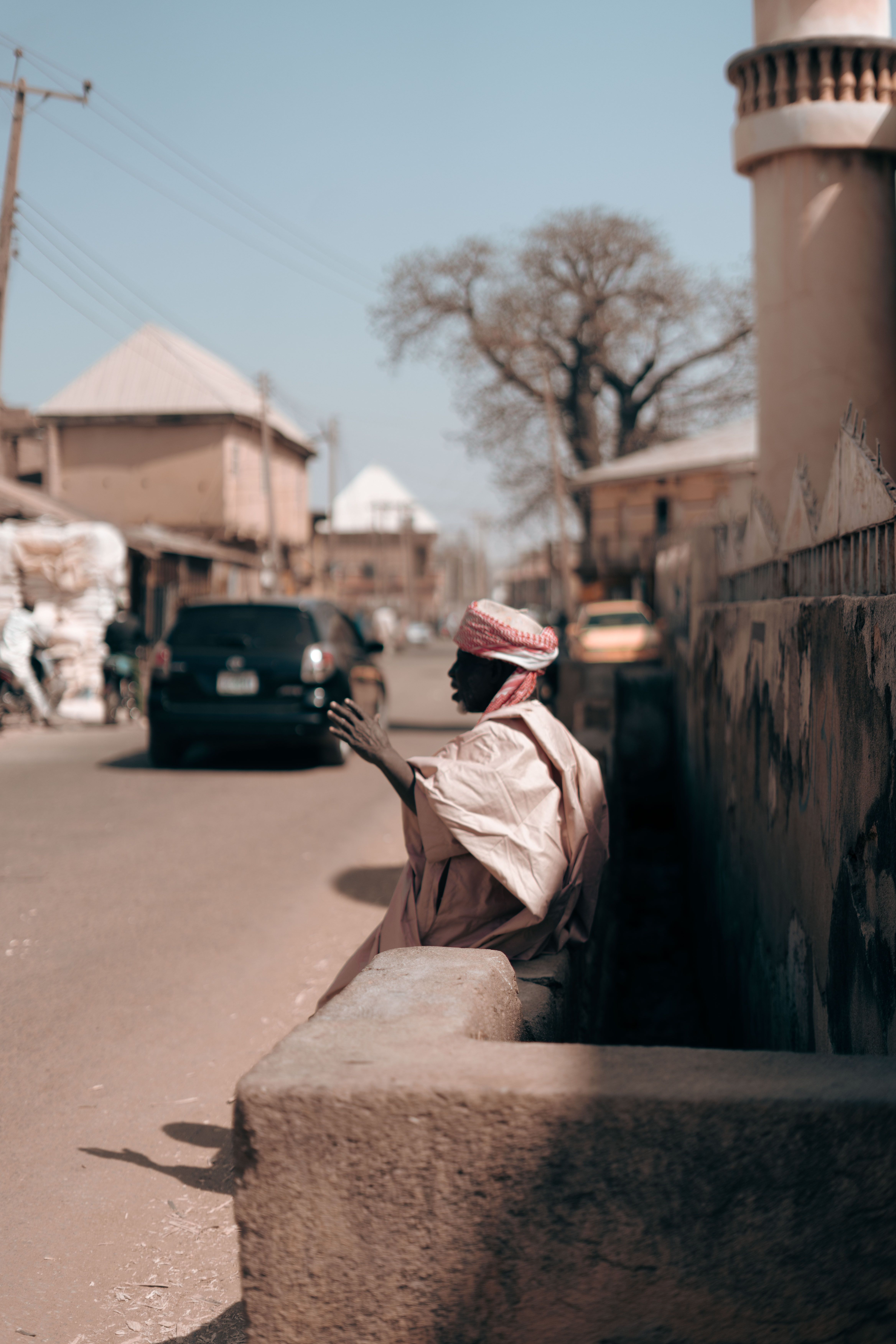 Street Scene with Local Man in Traditional Attire · Free Stock Photo