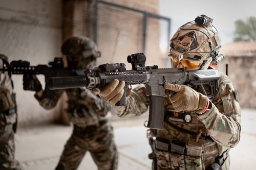 Free Armored soldiers in action during indoor training exercises, equipped with tactical gear. Stock Photo