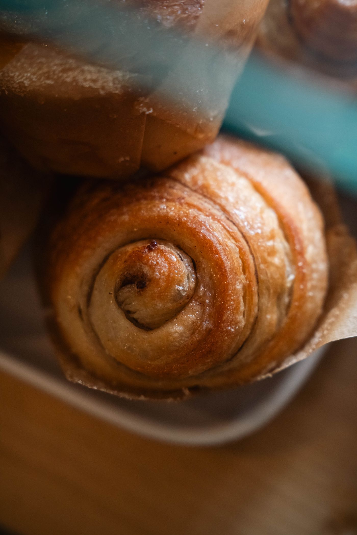 Illustrative stock photograph of golden cinnamon buns with visible spirals; the recipe makes one larger brioche spiral.