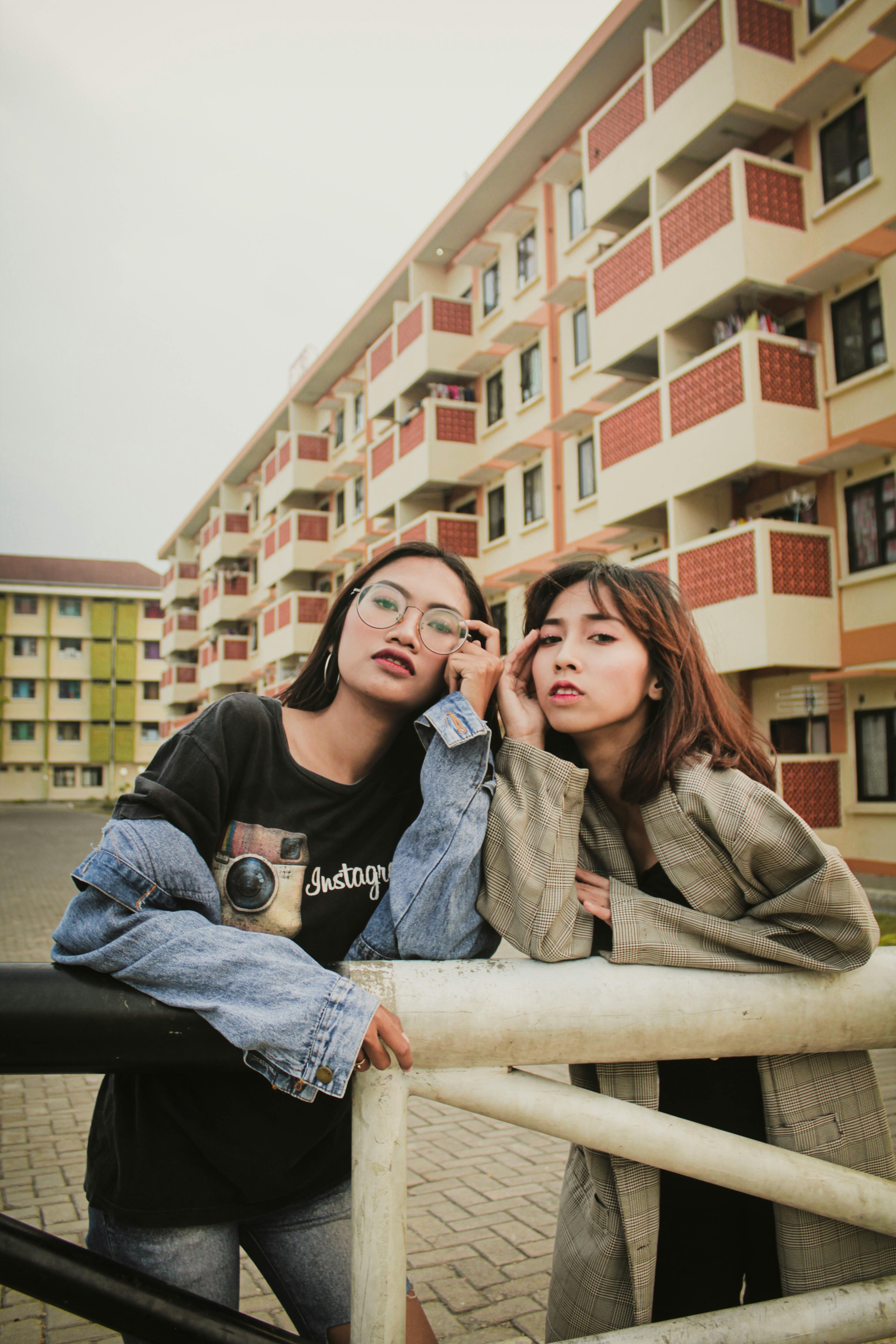 3 Women Sitting on Brown Wooden Bench · Free Stock Photo