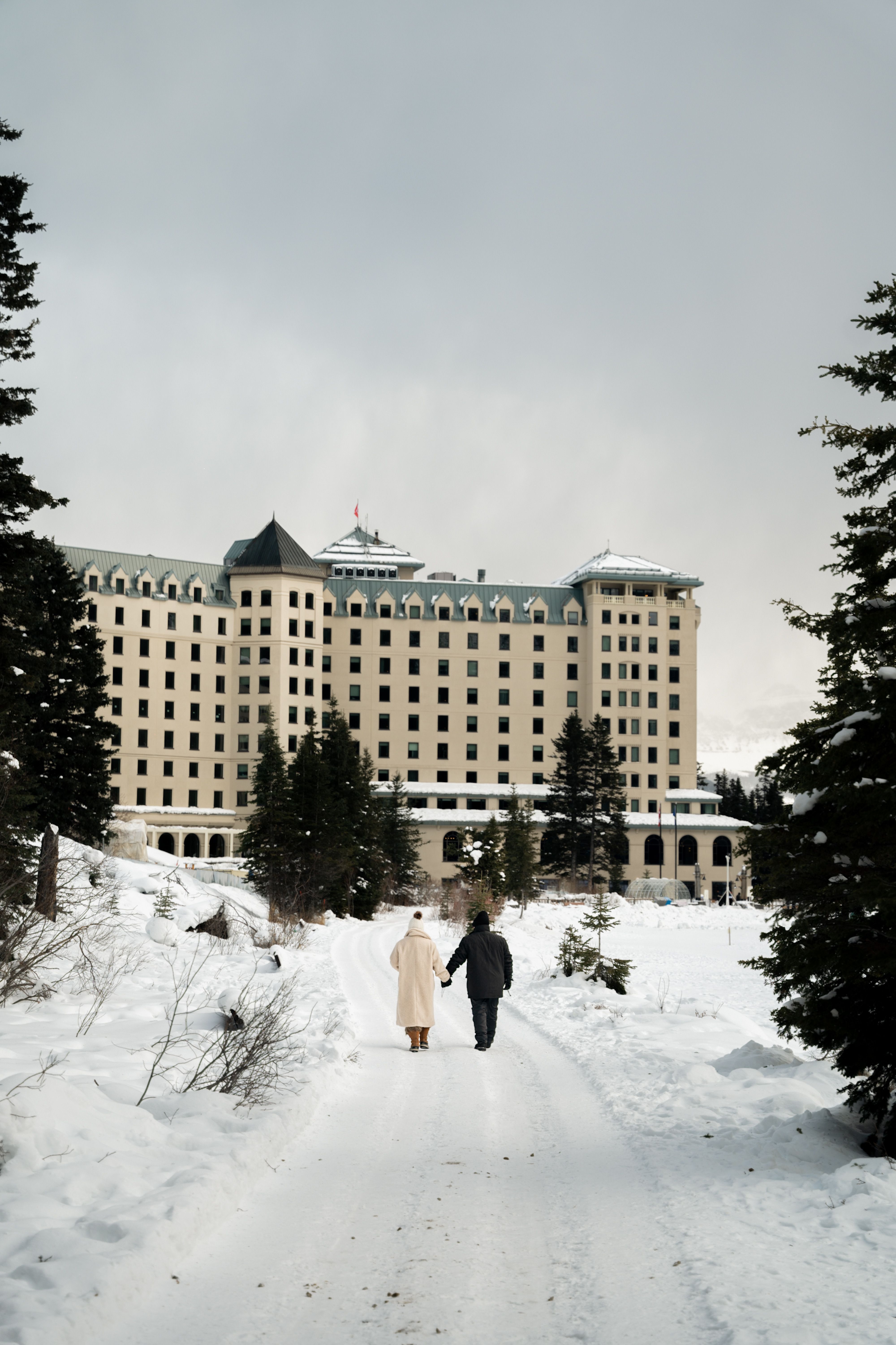 Winter Stroll at Fairmont Chateau Lake Louise · Free Stock Photo