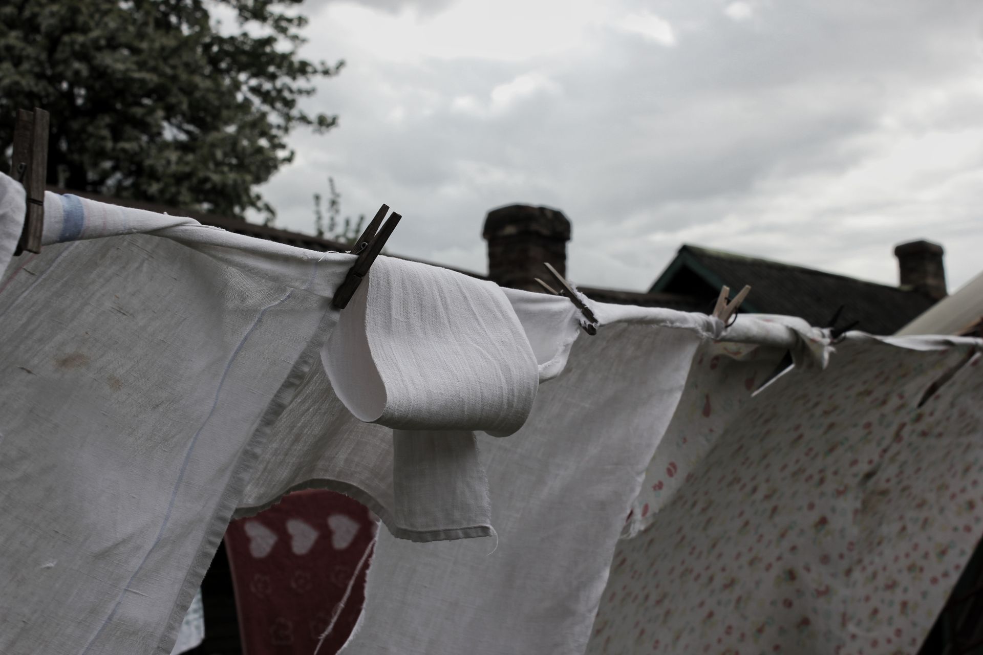 Clothes drying on a line with clothespins on a cloudy day in Wrocław.