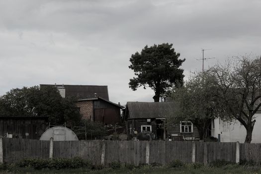 A tranquil rural scene featuring traditional homes and greenery in Wrocław, Poland.