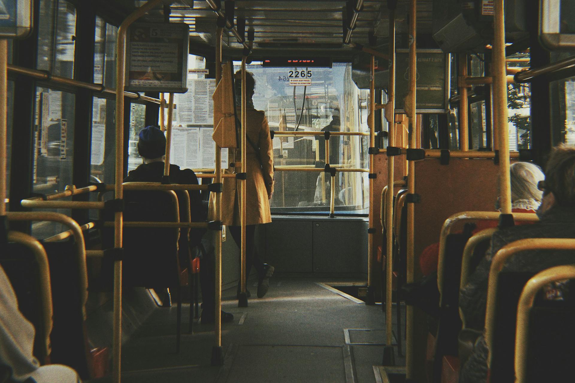 Passengers riding a city bus in Wrocław, Poland, showcasing daily public transport life.