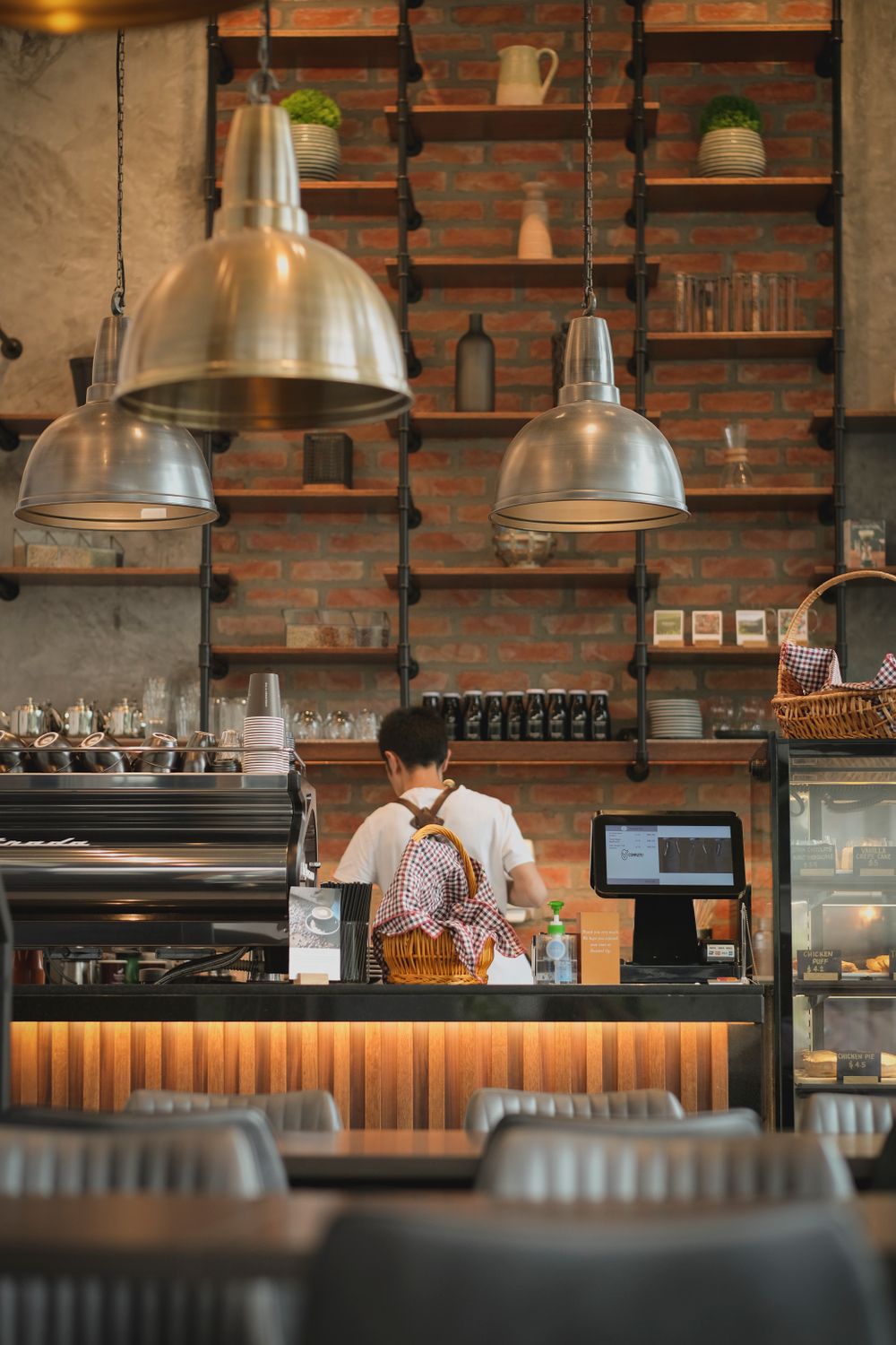 Cozy Modern Cafe Interior with Barista Working · Free Stock Photo