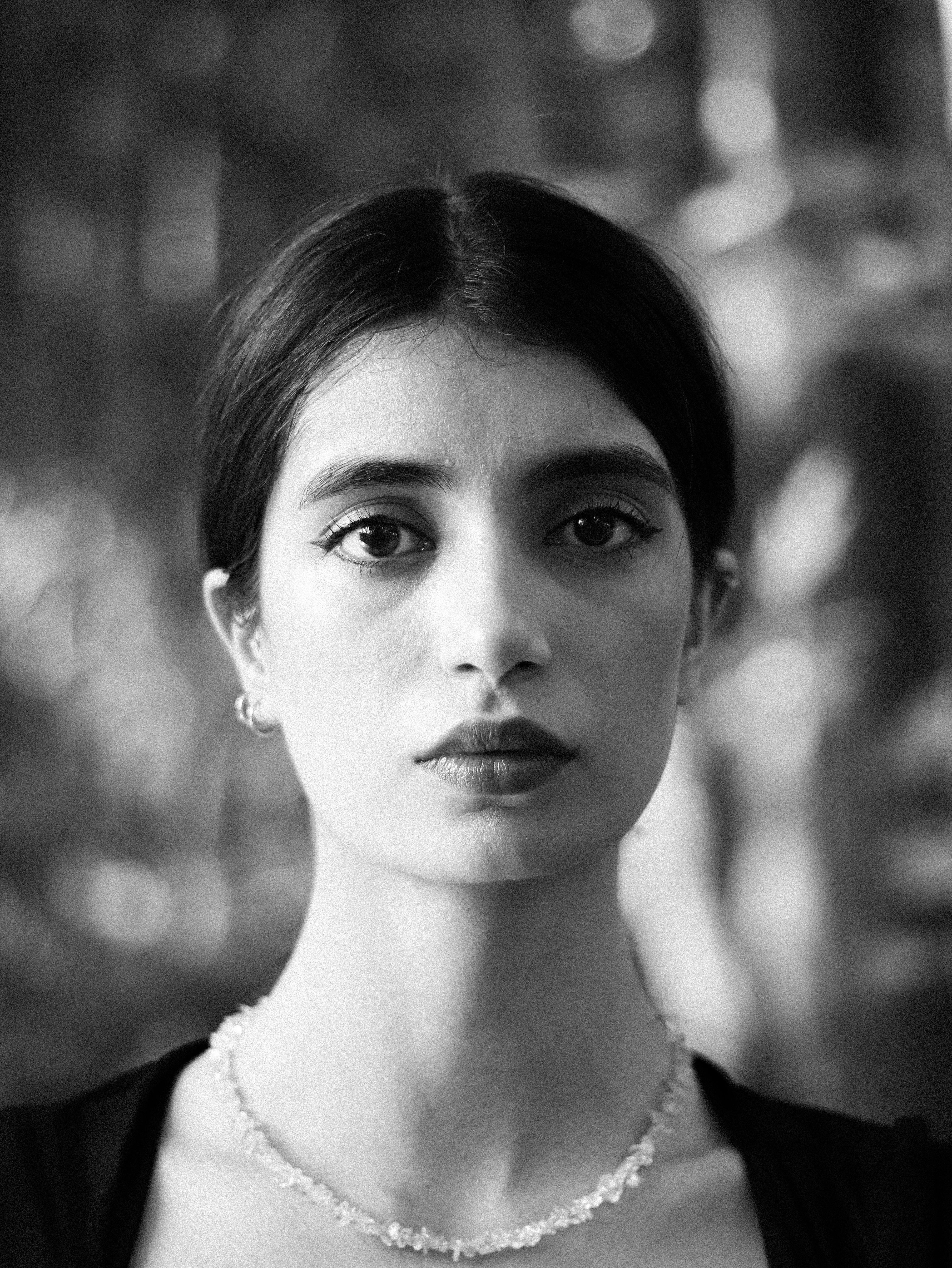 Artistic black and white portrait capturing the elegance of a Middle Eastern woman.