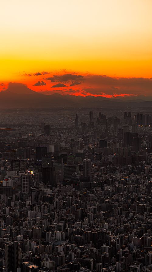 Free A breathtaking view of Kamakura cityscape drenched in vibrant sunset hues. Stock Photo