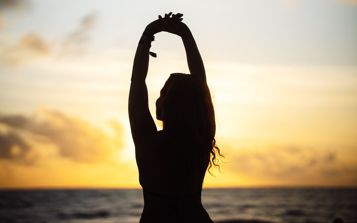 Sunrise mobility flow session on the beach