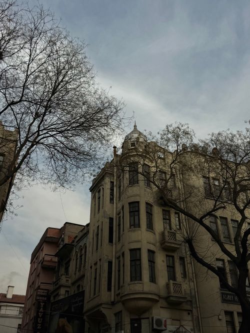 Free Classic historic architecture with an overcast sky creating a moody atmosphere. Stock Photo