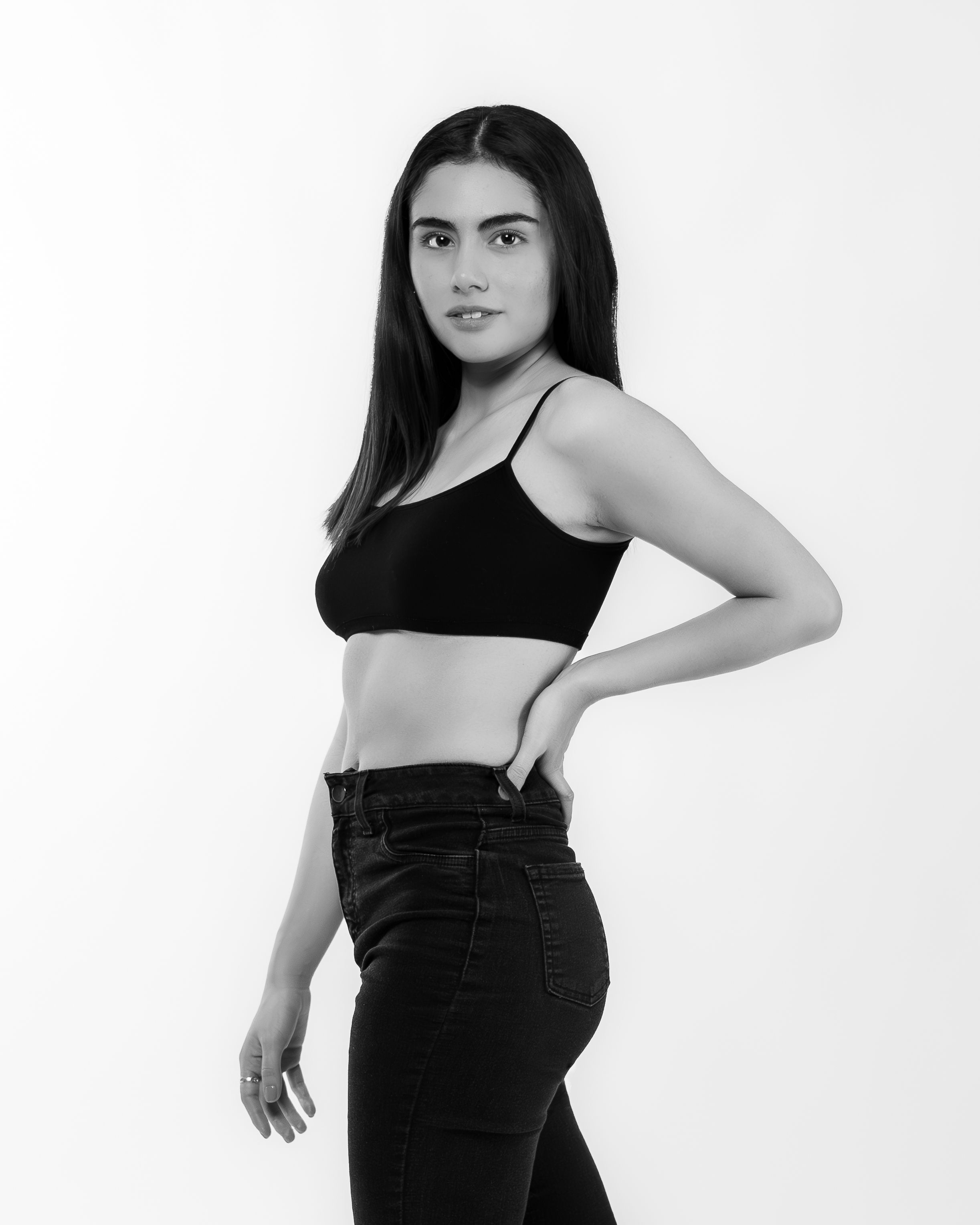 Elegant black and white portrait of a woman striking a stylish pose in Mexico City.