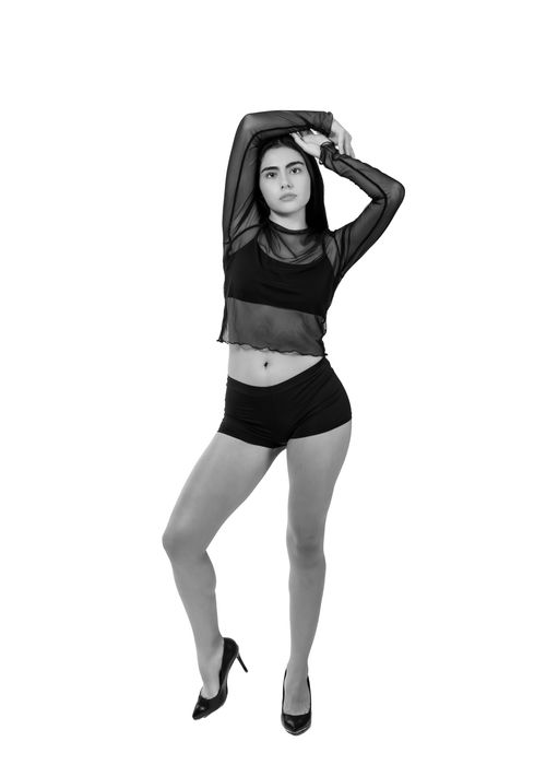 Free Stylish black and white portrait of a confident woman posing gracefully. Stock Photo