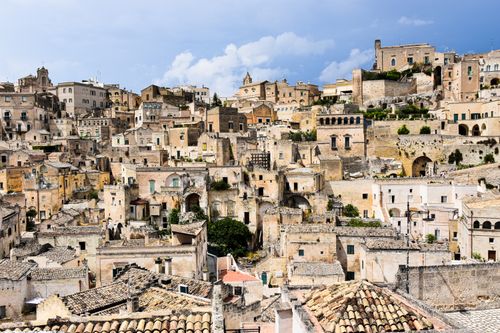 Free Explore the ancient stone city of Matera, Italy, featuring iconic architecture under a bright sky. Stock Photo