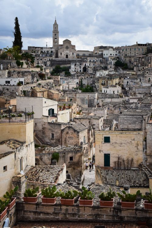 Free Discover the ancient charm of Matera with its historic architecture and scenic landscape. Stock Photo