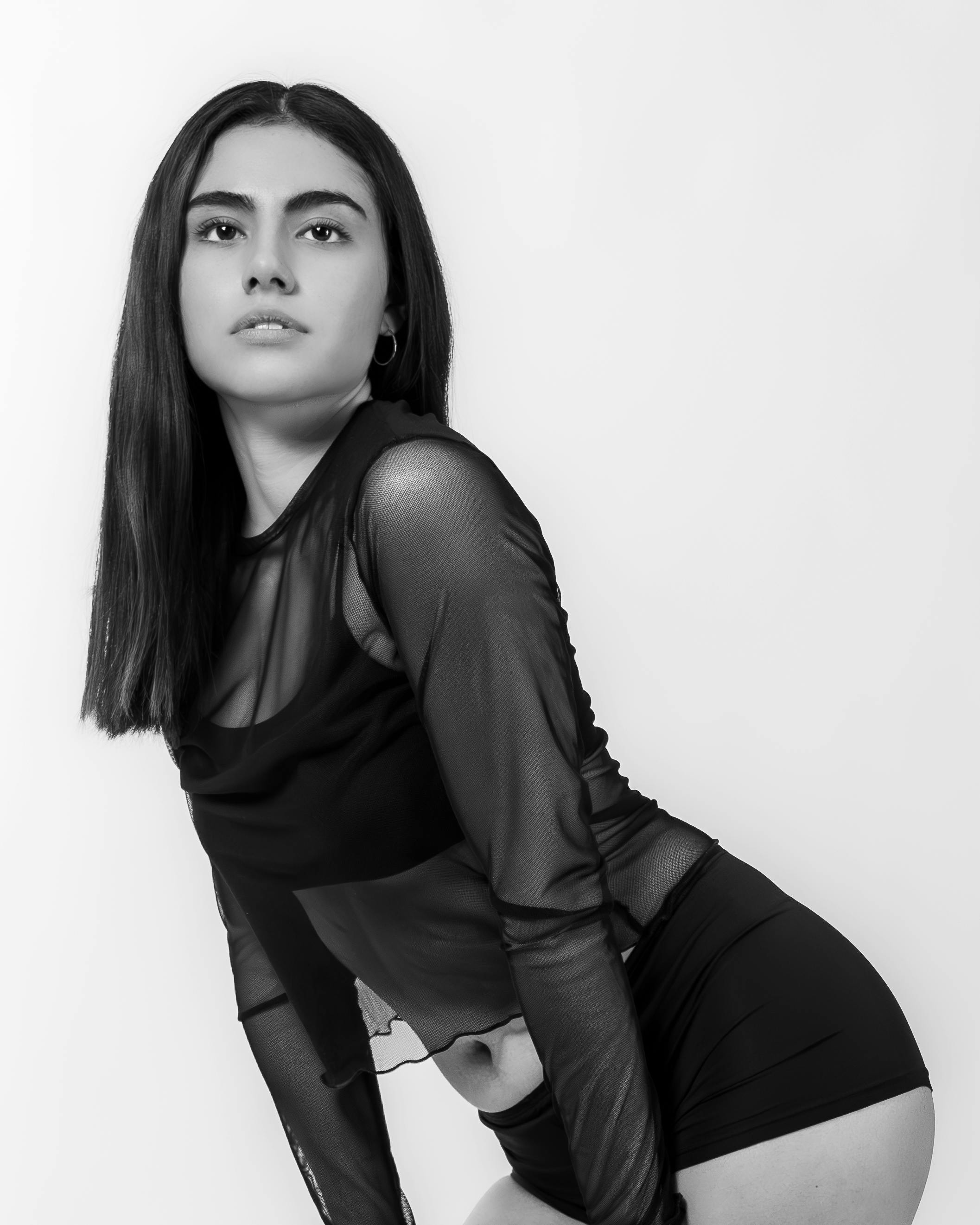 black and white portrait of a young woman posing