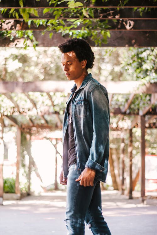 Selective Focus Photography Of Man In Blue Denim Jacket