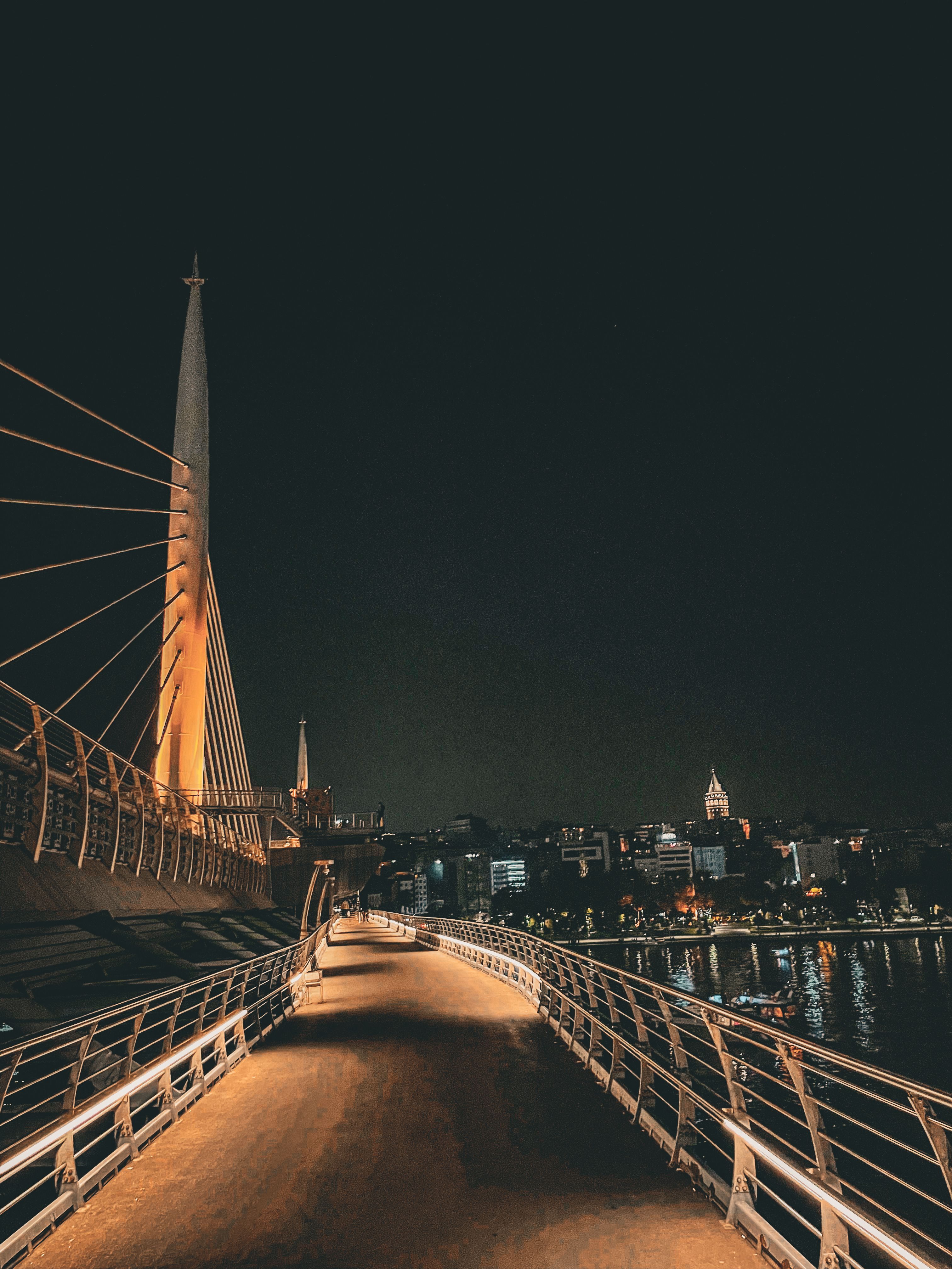 Modern Bridge Illuminated at Night in Cityscape · Free Stock Photo