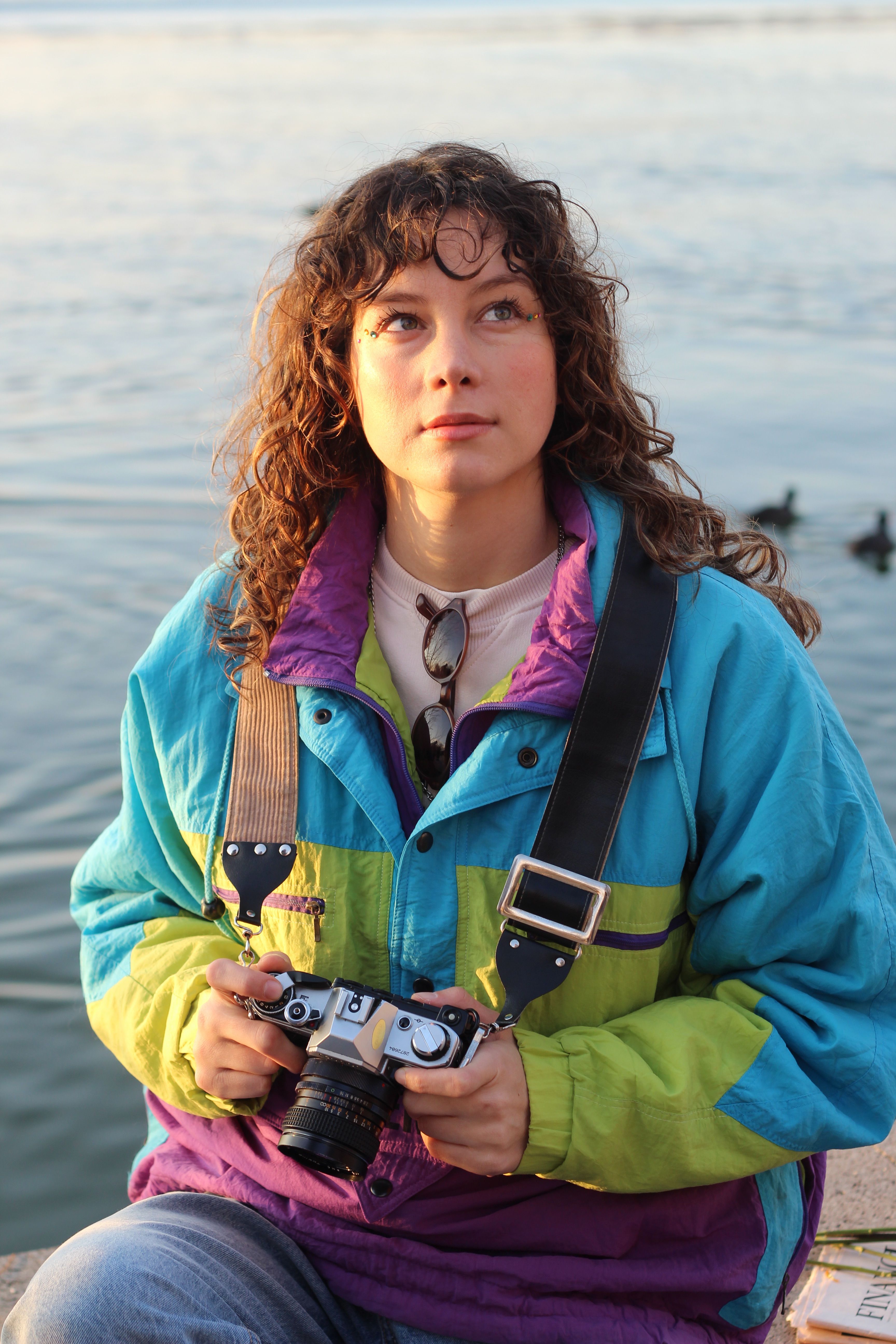 Young Woman with Vintage Camera by Waterfront · Free Stock Photo