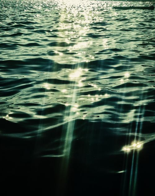 Free Beautiful sunlight reflections on ocean waves, captured in Rio de Janeiro, Brazil. Stock Photo