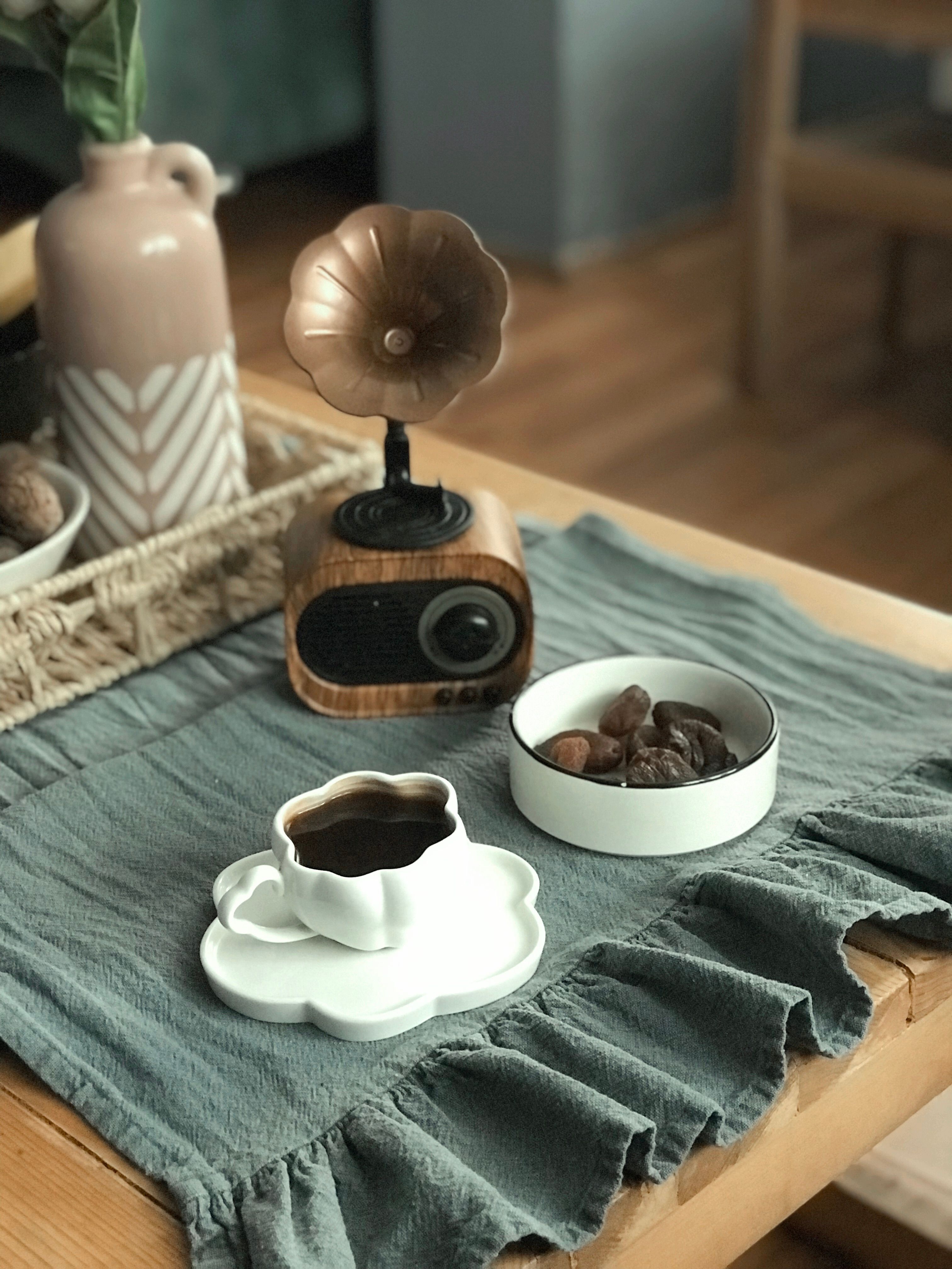 Warm setting with coffee and retro speaker