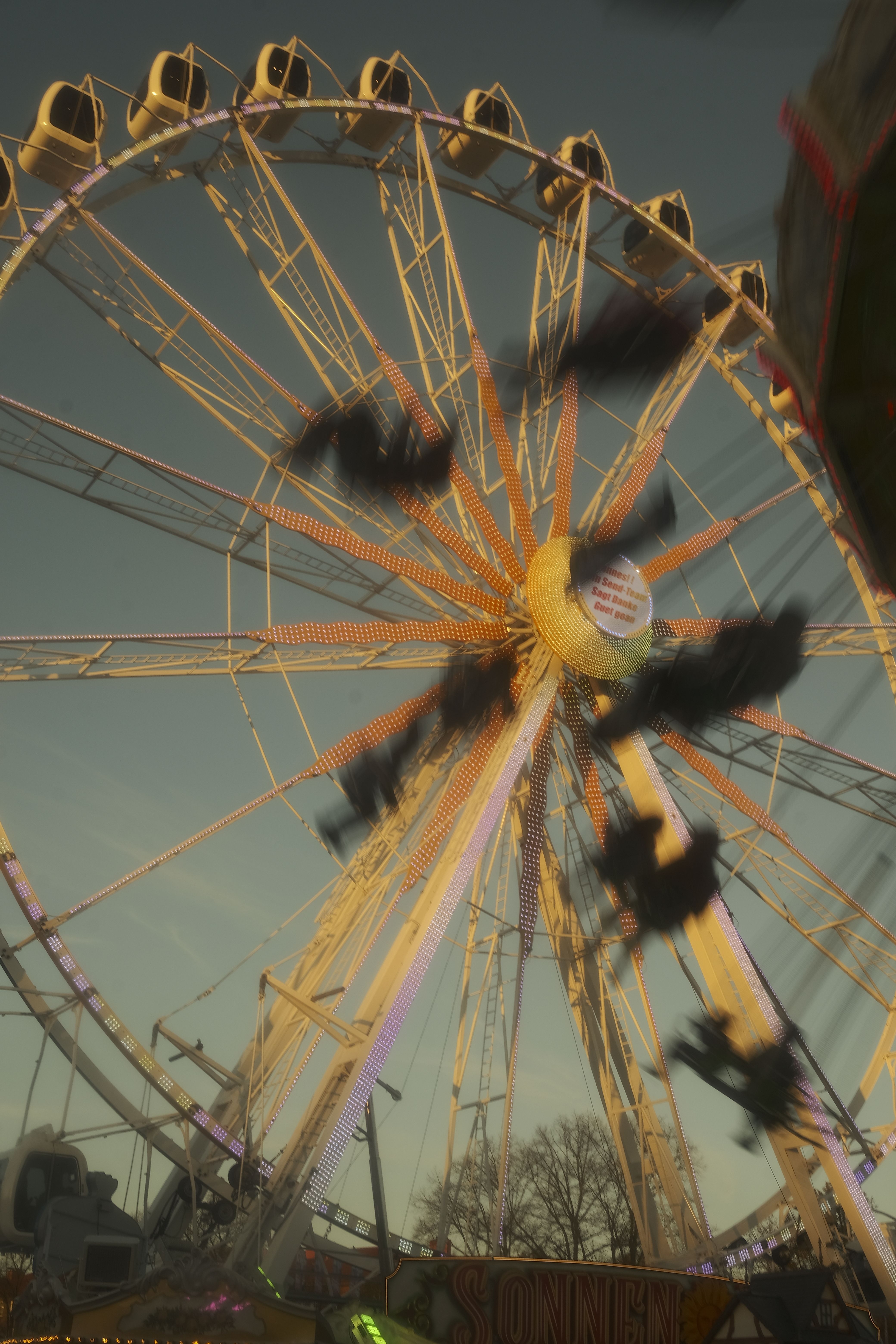 Ferris Wheel at Dusk with Motion Blur · Free Stock Photo