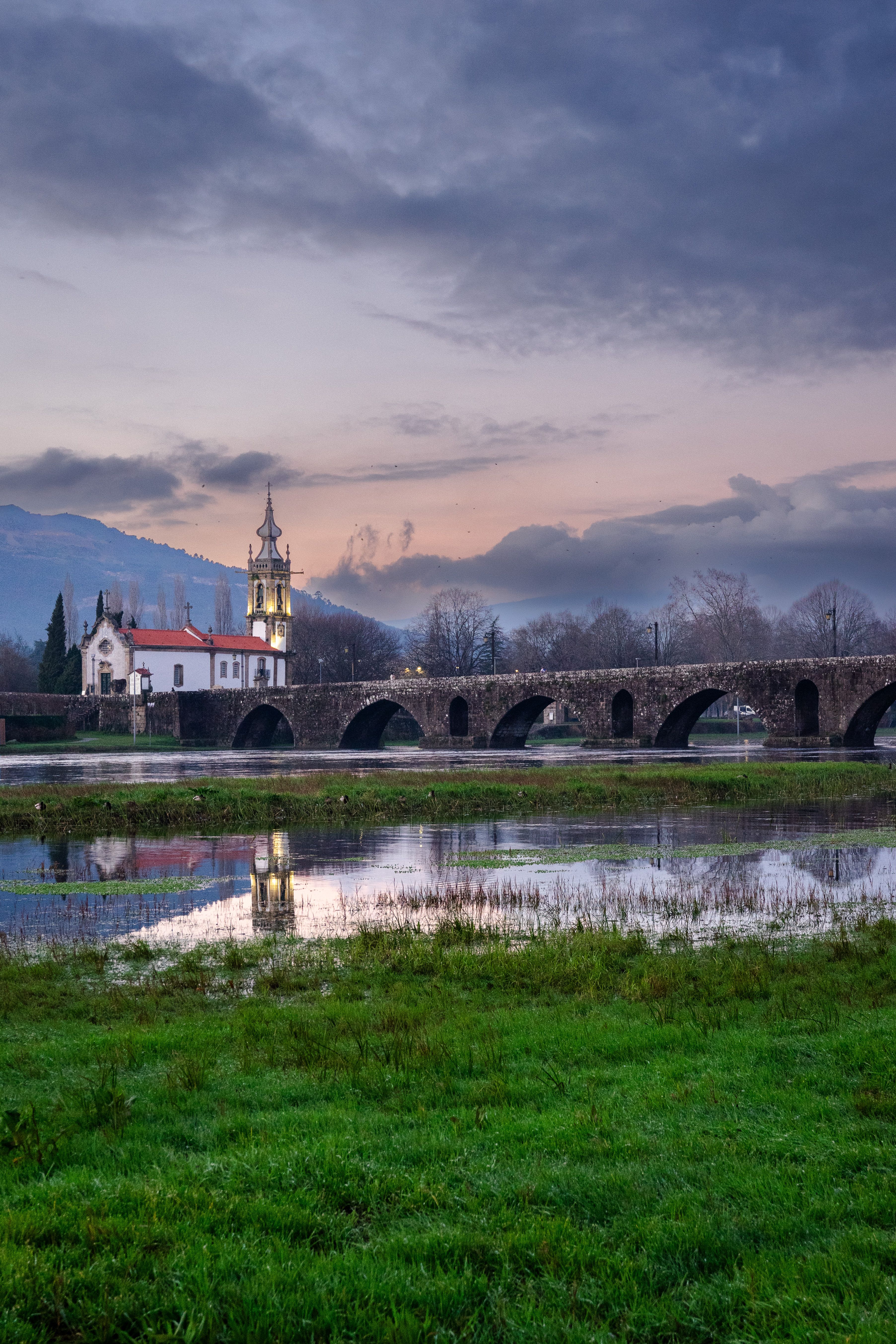 Beautiful Ponte de Lima in Portugal at dusk with reflections in the river.