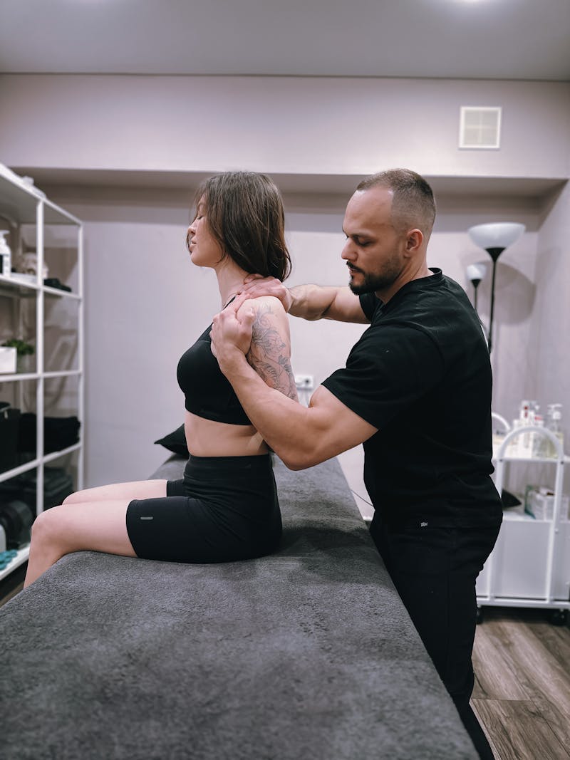 Chiropractor at Hubertus Chiropractic performing shoulder adjustment