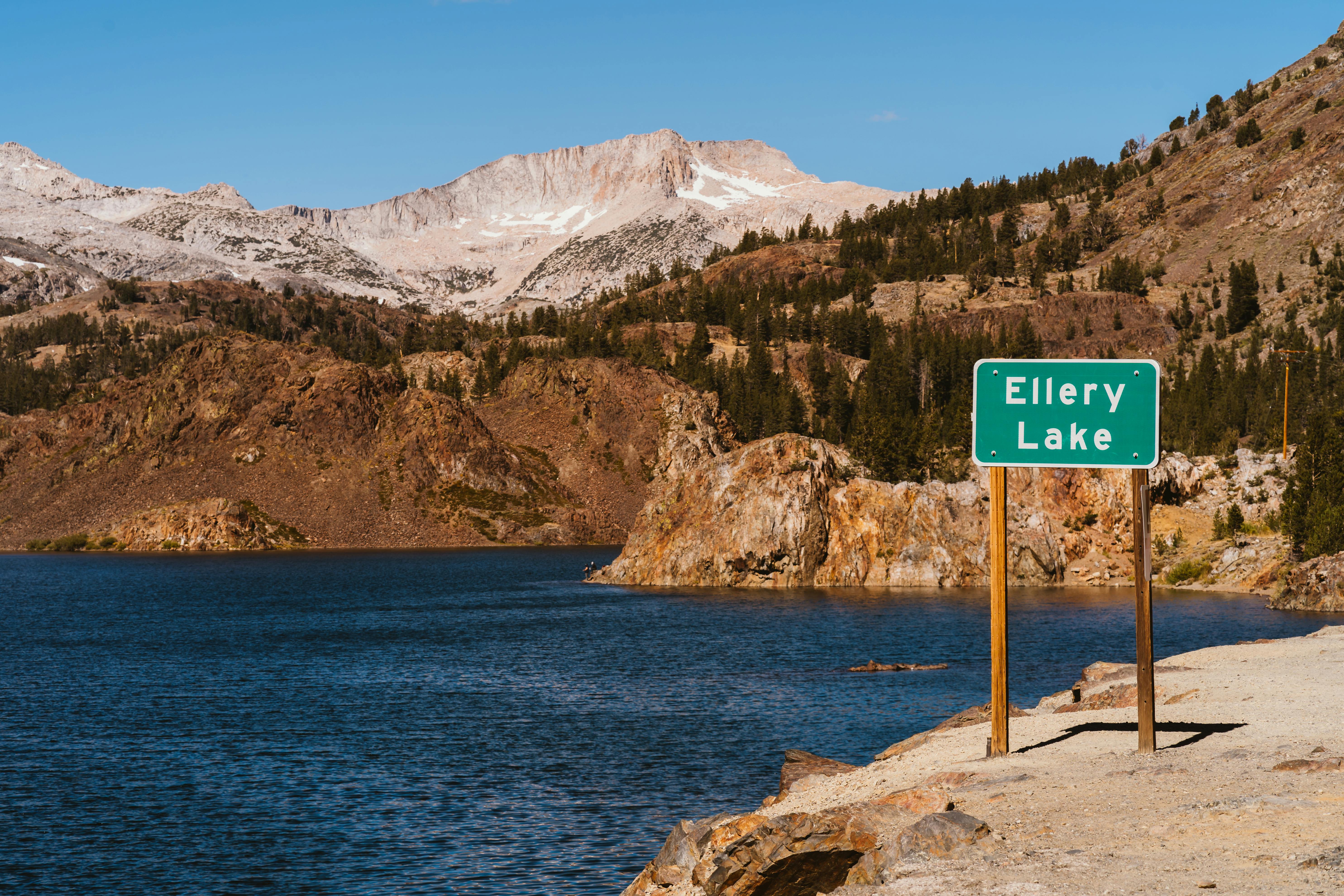 A Signage Of Ellery Lake By The Bank Surrounded By The View Of The
