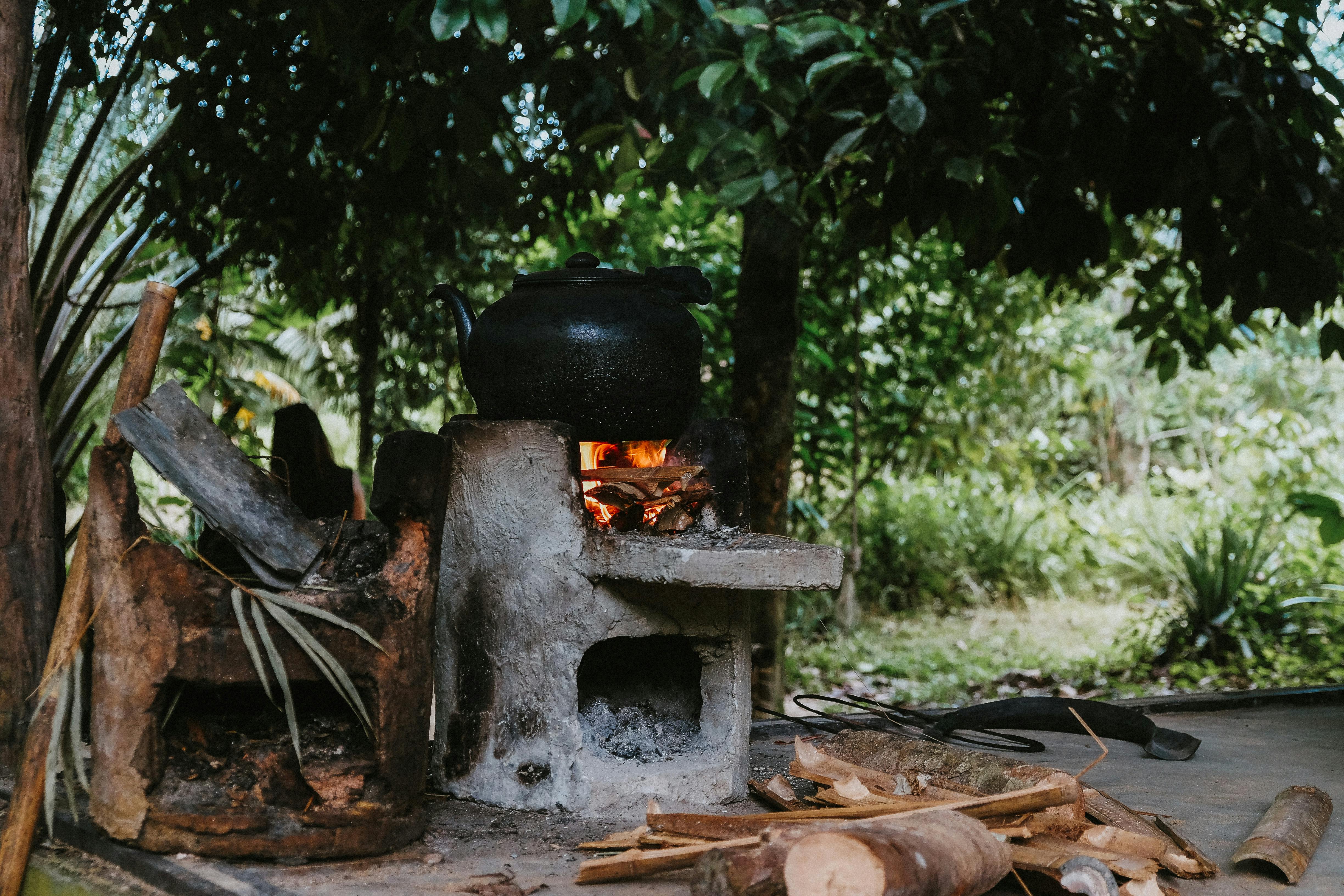 Traditional Cuisine Big Black Pot Cooking Food, Natural Fire With Wood  Heating Stock Photo, Picture and Royalty Free Image. Image 91283660.