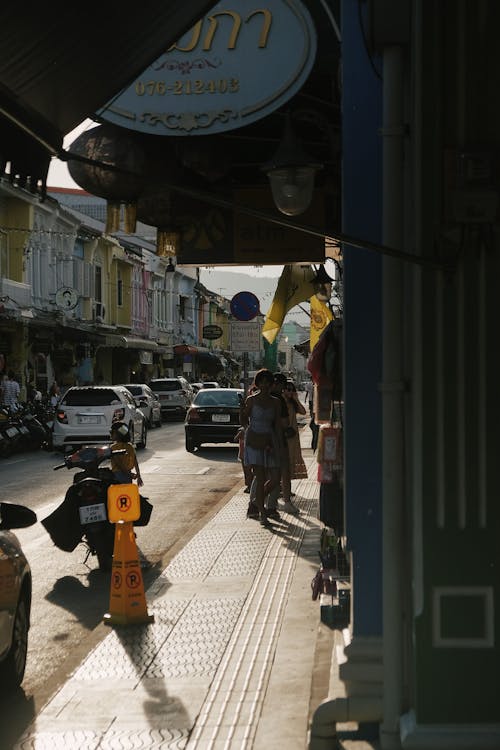 People Walking On The Sidewalk