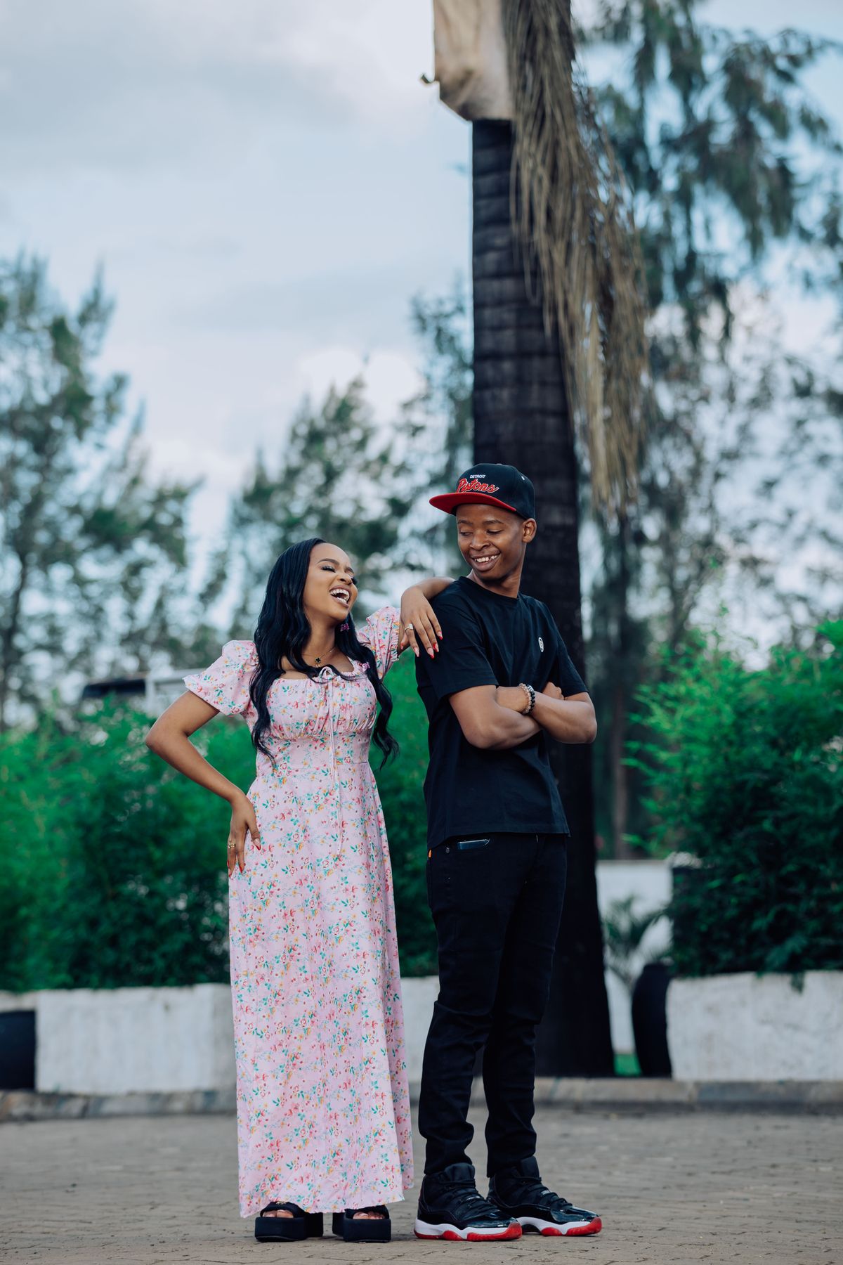 Couple laughing together outdoors — spontaneous date energy