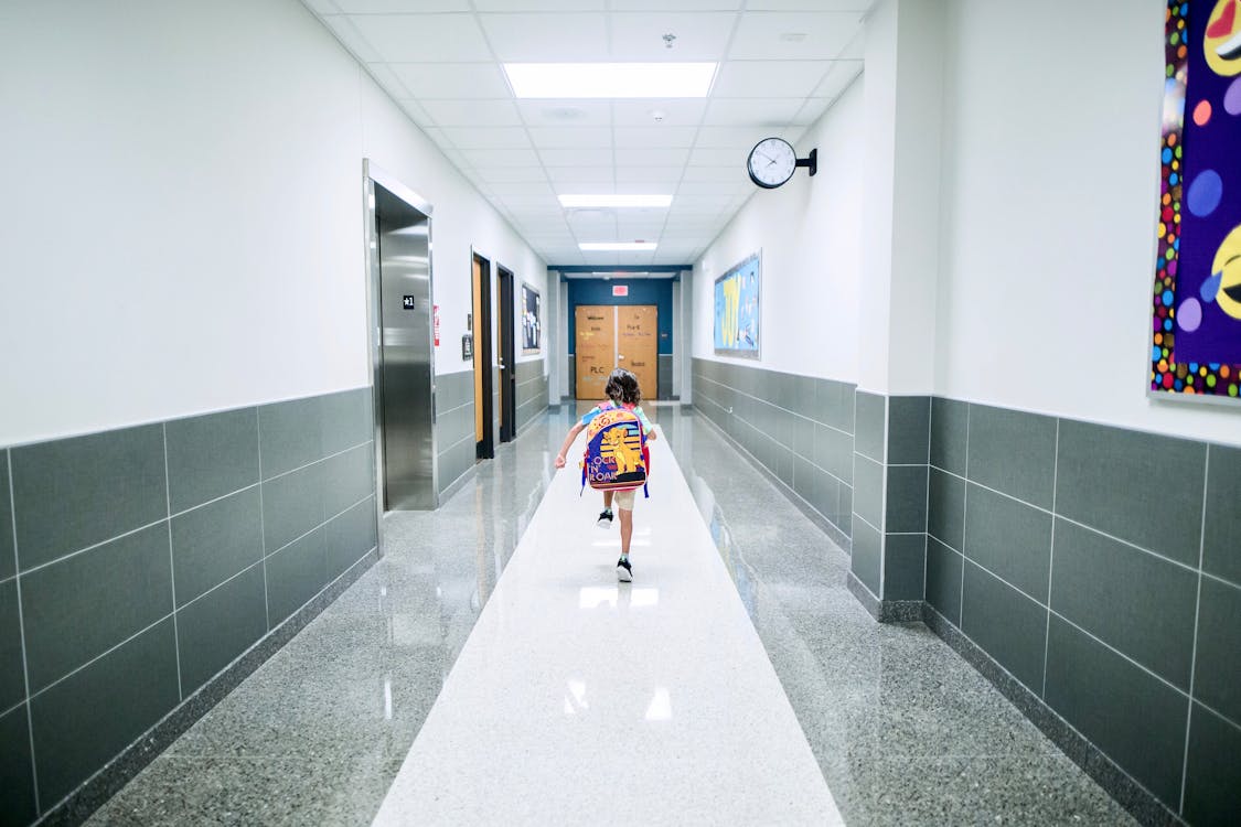 Free Boy Running In The Hallway Stock Photo