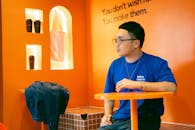 Casual Man in Stylish Café with Motivational Quote