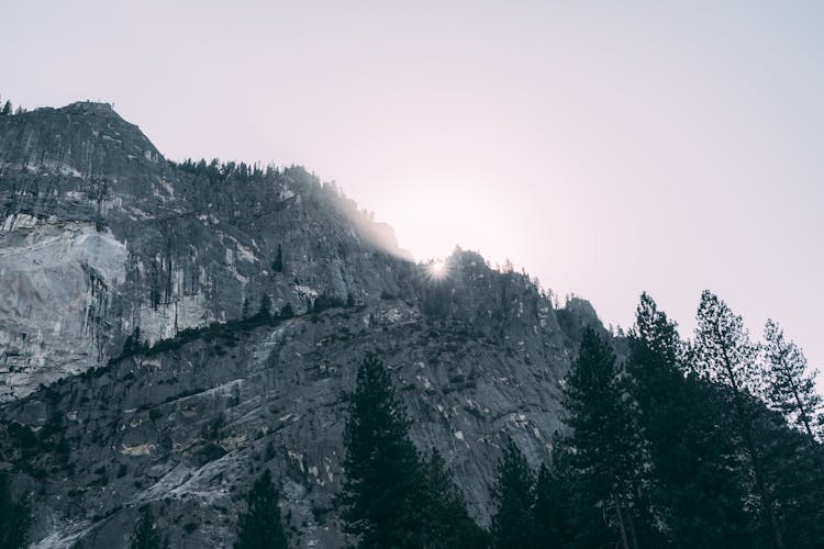 Grayscale Photo Of Rocky Mountain Peaks