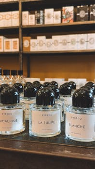 Elegant Byredo perfume bottles elegantly displayed in a Parisian store.