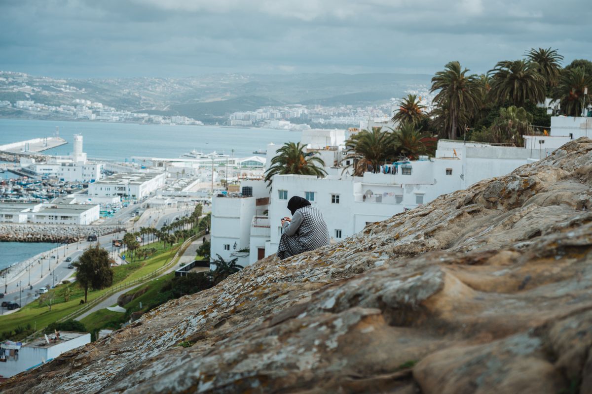 Tangier's whitewashed hillside above the bay — the most northwestern point of Africa, with Spain visible across the Strait.