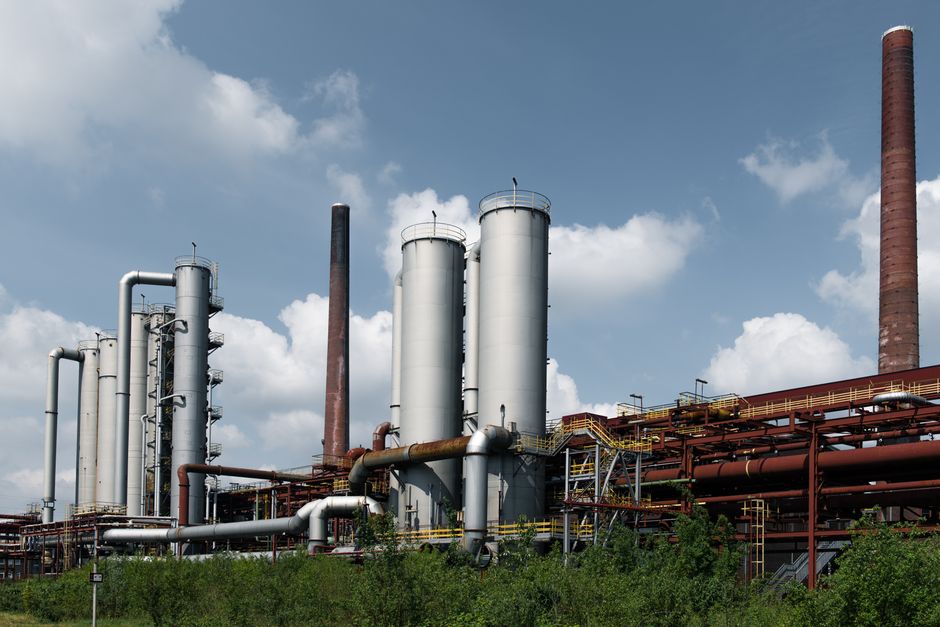 Historic industrial architecture at Zollverein Coal Mine, Essen, Germany, showcasing iconic smokestacks.