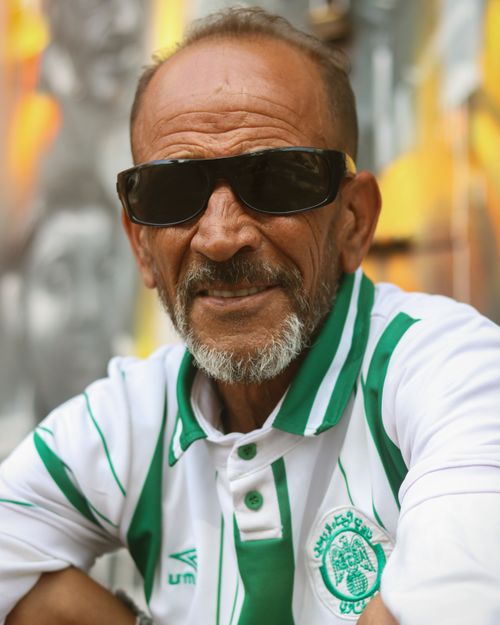Free Senior man wearing sunglasses and a patterned shirt in Casablanca, Morocco, an urban setting. Stock Photo