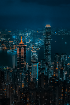 Breathtaking view of Hong Kong's skyline illuminated at night, featuring iconic skyscrapers.
