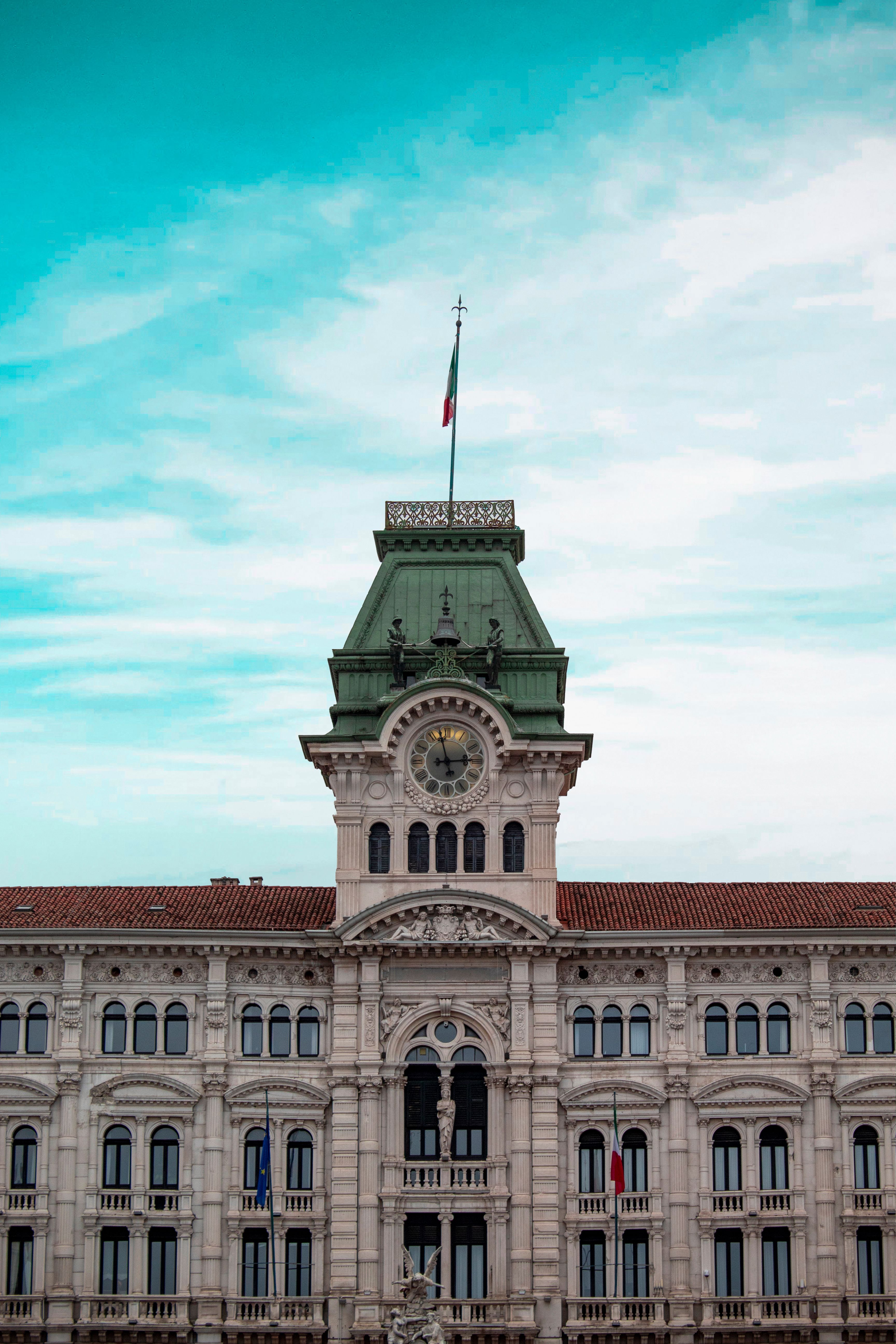 Palazzo del Municipio in Trieste Italy with clock tower and Italian flag