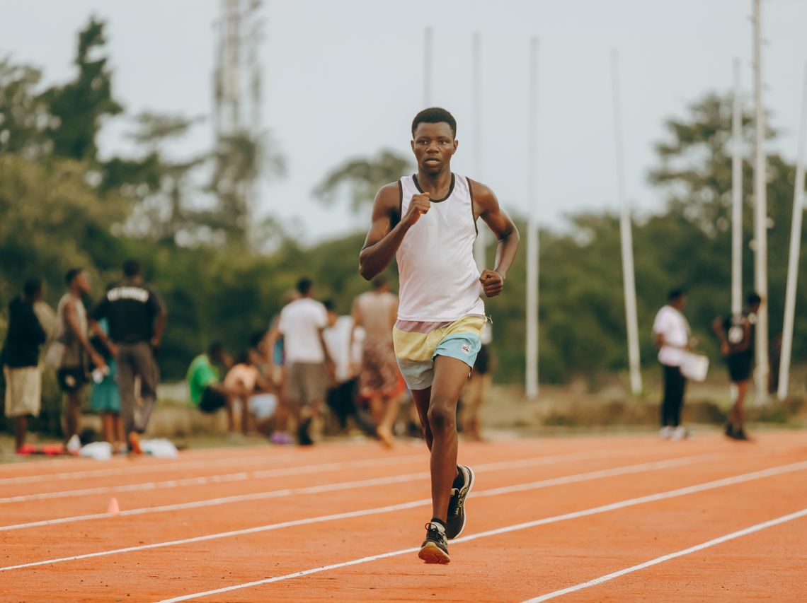 Young athlete running on an outdoor track