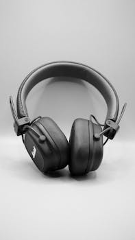Classic black studio headphones on a minimalist white backdrop.