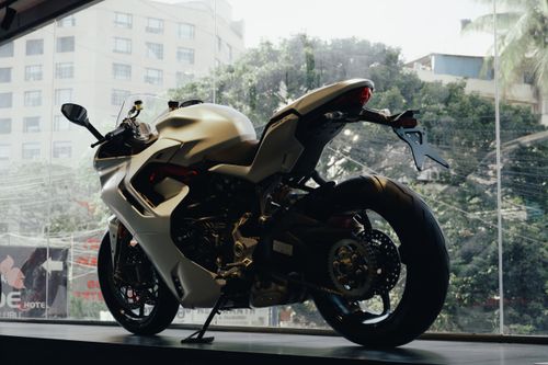 Free A sleek Ducati motorbike on display indoors, showcasing its modern design. Stock Photo