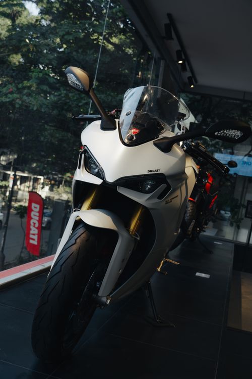 Free Capture the sleek design of a Ducati bike displayed in a Bengaluru showroom, embodying modern motorcycle culture. Stock Photo