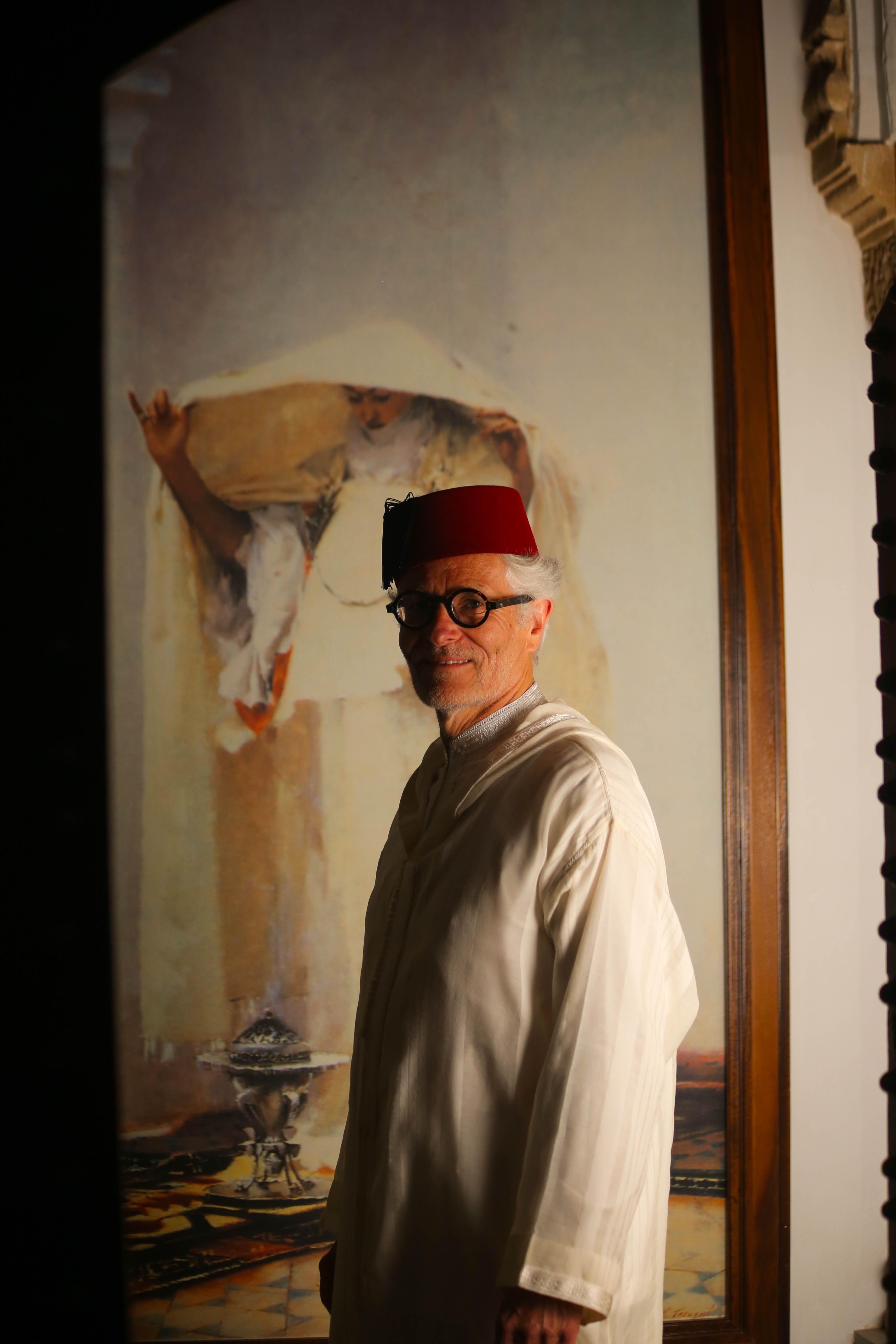 Elderly man wearing traditional Moroccan clothing indoors, Rabat.