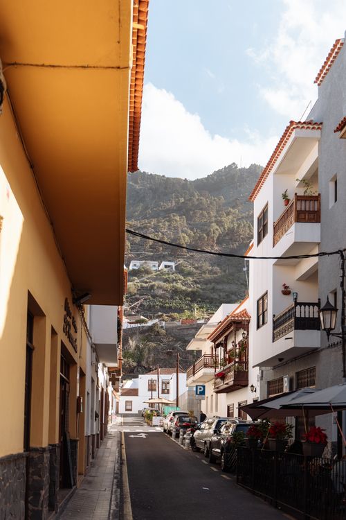 Free A picturesque street scene in the Canary Islands featuring colorful facades and traditional charm. Stock Photo