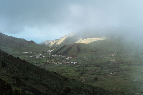 Free Picturesque green valleys of La Gomera under cloudy sky, showcasing rural charm. Stock Photo
