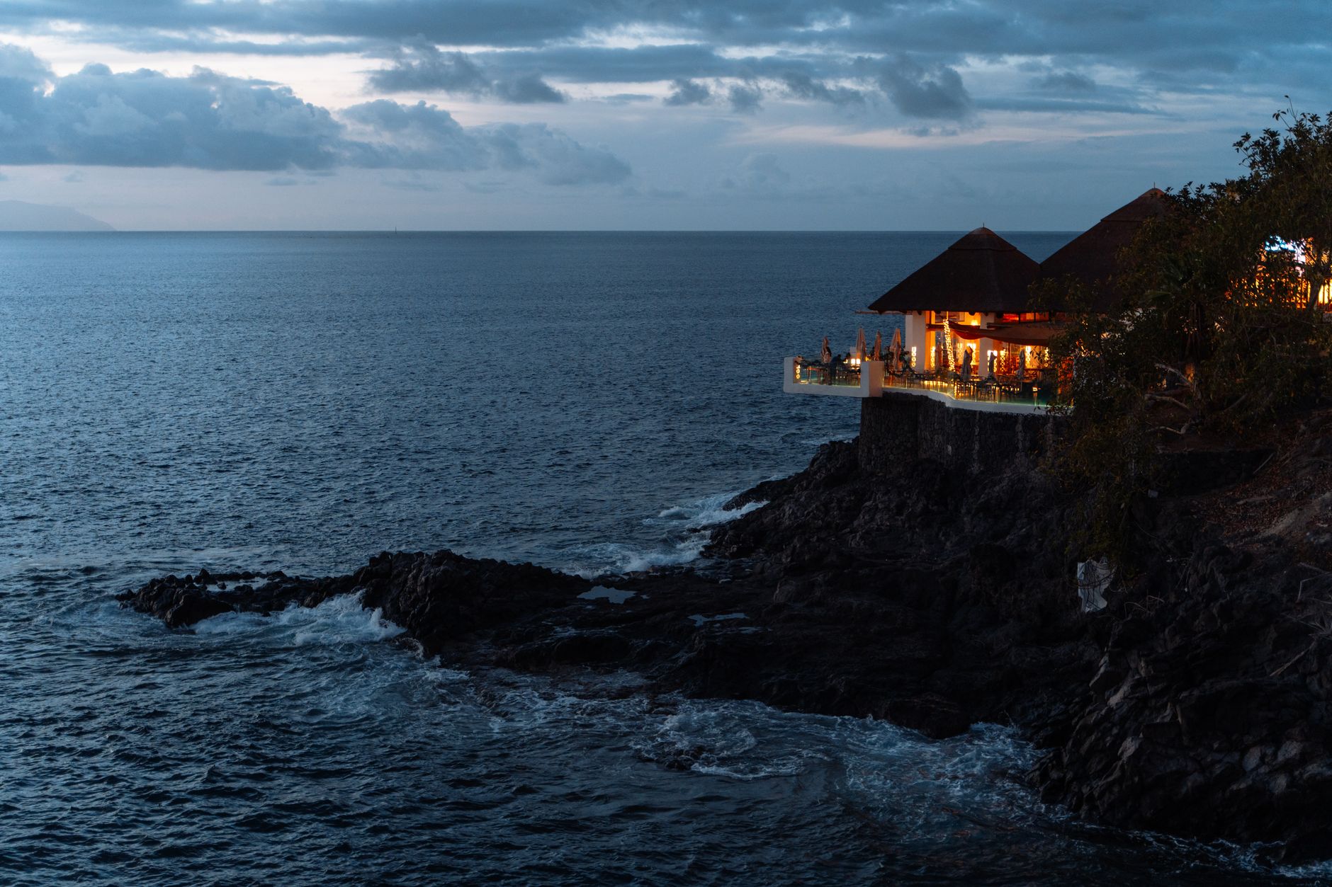 Experience tranquil clifftop dining with ocean views in the Canary Islands.