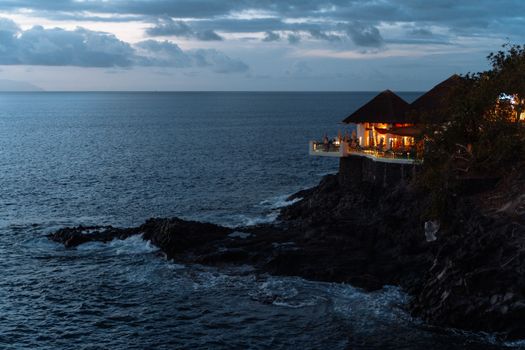 Experience tranquil clifftop dining with ocean views in the Canary Islands.