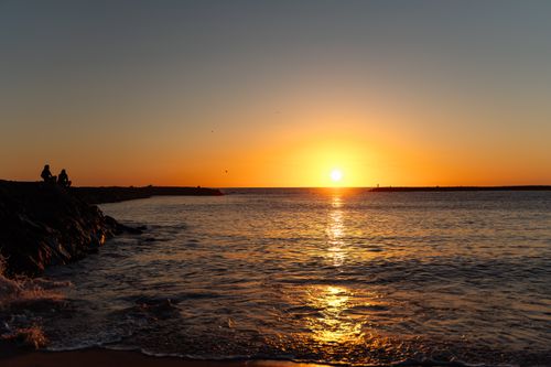 Free Captivating sunset at Playa de las Americas, a tranquil coastal paradise in the Canary Islands. Stock Photo