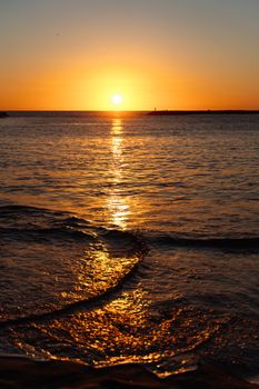 Golden sunset over the calm waters of the Canaries, perfect for tranquil escapes.